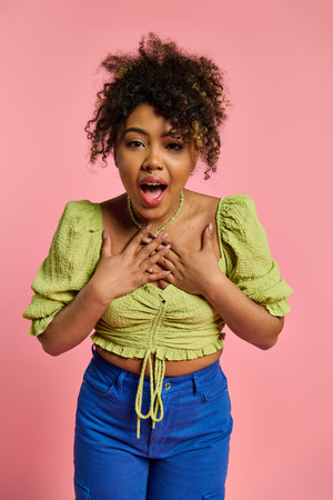 African American woman in stylish attire looking surprised.