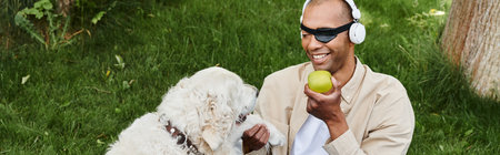 A diverse African American man with myasthenia gravis holds an apple while his Labrador dog stands...