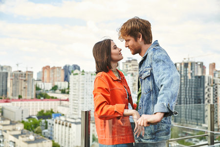 A man and a woman standing close together, sharing a moment of connection and understandingの写真素材