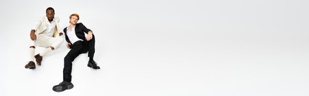 Three multicultural men exude elegance and style standing together.の写真素材