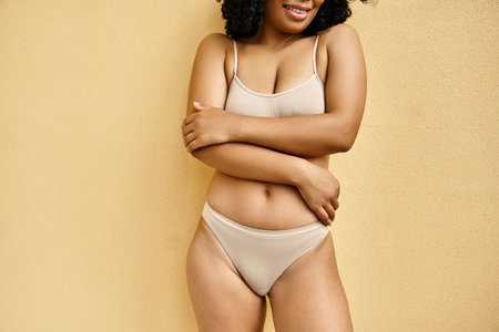 A beautiful woman in a bikini striking a pose for a picture.の写真素材