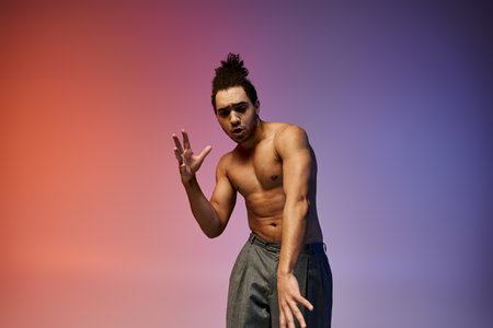 A young African American man dances against a colorful gradient backdrop, his expression intense and...