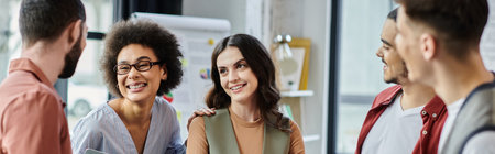 Good looking colleagues share smiles and support amidst a challenging layoff process.の写真素材