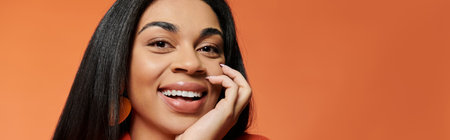 A joyful African American woman showcases her beautiful smile.の写真素材
