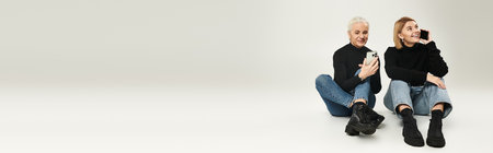 A mother and daughter share joyful moments together on a relaxing day.の写真素材