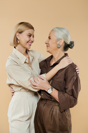 A joyful moment shared between a mother and daughter in a warm setting.の写真素材