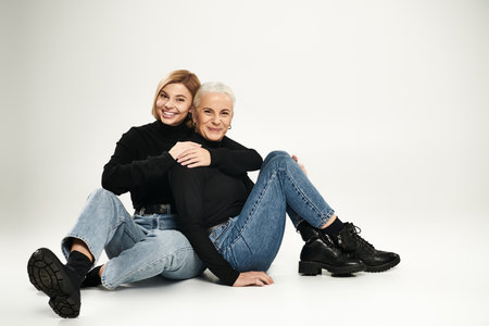 A mother and daughter share a joyful moment, embracing each other warmly.の写真素材