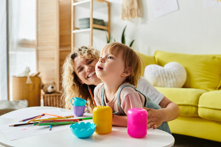 A curly-haired mother and her toddler daughter happily playing with toys in their cozy living room.の写真素材