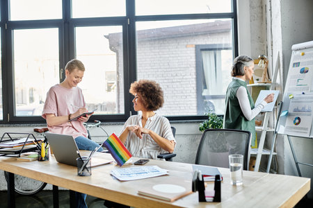 Cheerful diverse female professionals working together on their project in office.の写真素材