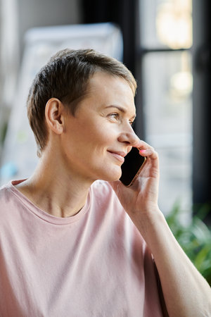 A stylish woman in business attire chatting on a smartphone.