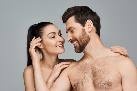 A man and a woman posing elegantly together.の写真素材