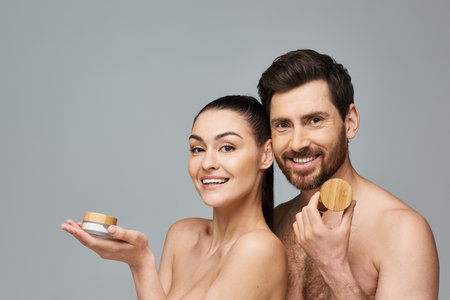 A stylish couple poses together in a skincare promotion.の写真素材