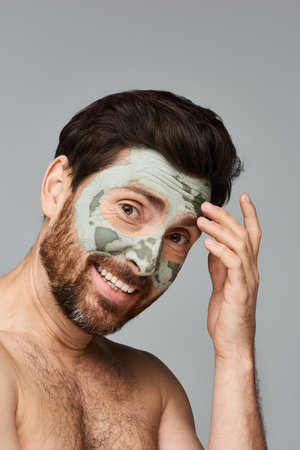 Alluring jolly man wearing a face mask.の写真素材