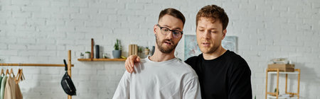 Two men, a gay couple, collaborate in a designer workshop to create trendy attire.
