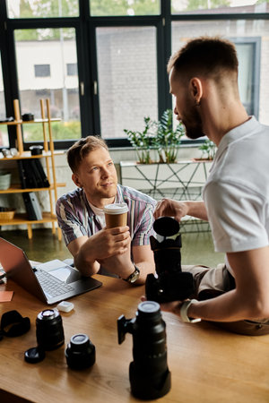 Group of men collaborating around a rustic wooden table.の写真素材