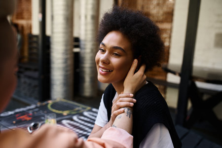 Two women having great time in cafe.の写真素材