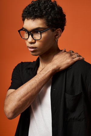 Handsome African American man in stylish black glasses and shirt.の写真素材