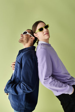 two men relaxing with sunglasses perched on their heads.