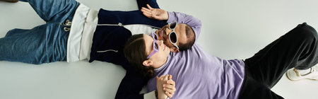 Two men entwined gracefully in a tender moment of connection.