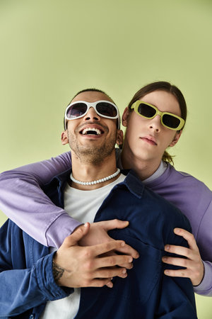 Two attractive men hug each other tenderly.