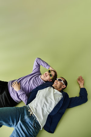 A couple of men laying intertwined in a serene moment of connection.