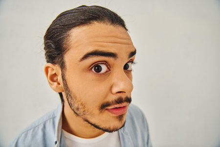 Man with mustache makes funny face.の写真素材