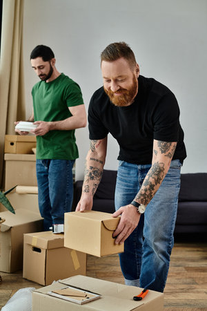 A gay couple in love unpacking boxes in their new living room, beginning a new chapter in their...