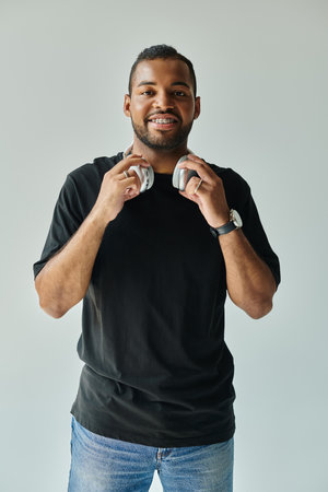 Stylish man with headphones in his hands.