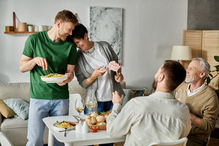 A gay couple enjoys a dinner with parents at home.の写真素材