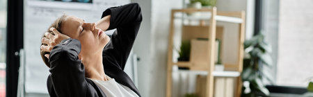 Middle aged woman in business suit stretching in office.