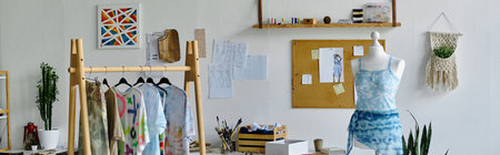 A glimpse into the creative space of a young gay fashion designer, showcasing his work reviving and transforming discarded clothing.の写真素材