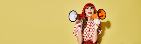 Redhead woman in clown costume with megaphone, creative pop art makeup, polka dot blouse, on yellow...