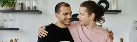 A young gay couple shares a tender moment in their modern kitchen, their smiles reflecting their...