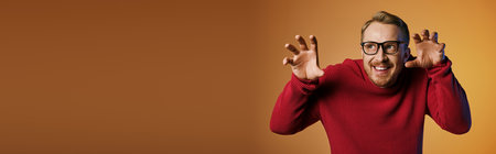 Handsome man in stylish red sweater making a quirky facial expression.