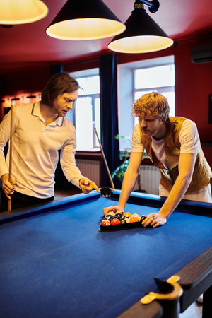 Friends casually dressed play a game of pool in a bar.