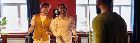 Friends stand around a pool table, laughing and enjoying a game of billiards.