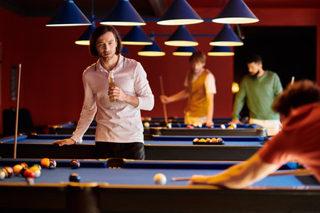 A group of friends enjoy a casual evening of billiards and drinks.