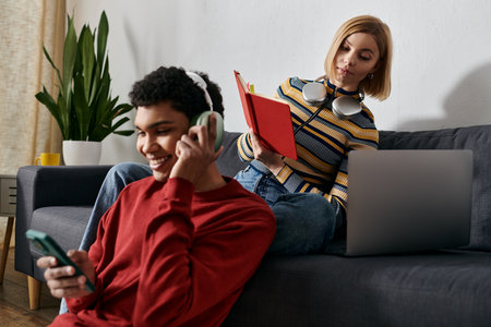 A young couple relaxes in their modern apartment, enjoying the evening together.