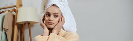 A young woman relaxes in her home, wearing a white towel and a robe.