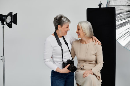 A photographer captures a tender moment between two women in a studio, their laughter and love...