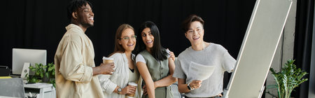 A group of young professionals work together in a bright office space.