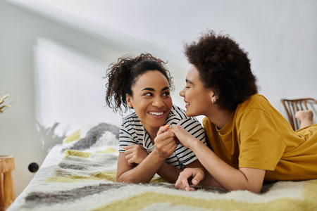 A couple shares laughter and affection while relaxing together indoors.の写真素材