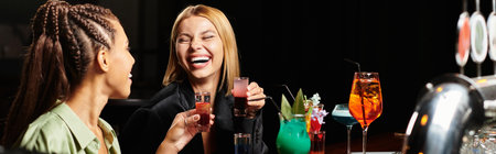 Colleagues enjoy a vibrant atmosphere while toasting with playful cocktails and laughter.