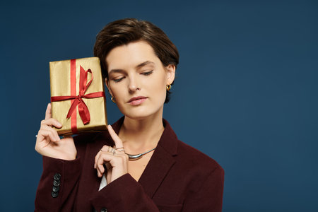 In a cozy winter scene, a woman in elegant attire holds a wrapped gift, radiating warmth.