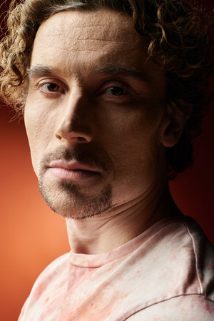 A handsome man shares his emotional depth in vibrant hues.