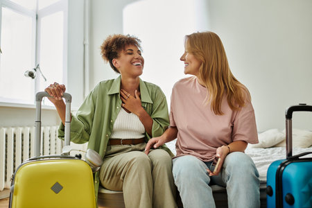 Two partners share a joyful moment while preparing for their adventure.の写真素材