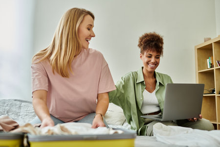 Two partners share laughter and excitement while preparing for their adventure.の写真素材