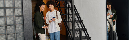 A joyful couple stands in a hostel, sharing travel plans while preparing to explore the area.