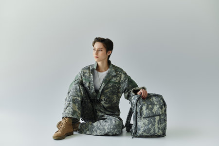 A soldier prepares for service in a studio setting.