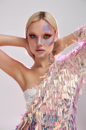 A stylish young woman showcases her unique holographic fashion look.